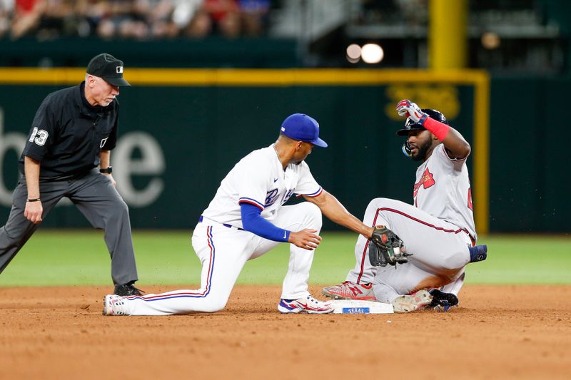 May 15, 2023; Arlington, Texas, USA; Atlanta Braves center fielder Michael Harris II (23) slides in under a tag by Texas Rangers second baseman Marcus Semien (2) for a double during the eighth inning at Globe Life Field. Mandatory Credit: Andrew Dieb-USA TODAY Sports