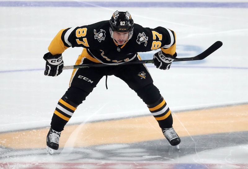 Dec 3, 2024; Pittsburgh, Pennsylvania, USA;  Pittsburgh Penguins center Sidney Crosby (87) waits to take the opening face-off against the Florida Panthers during the first period at PPG Paints Arena. Mandatory Credit: Charles LeClaire-Imagn Images