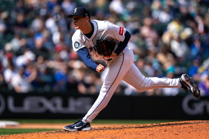 Apr 30, 2025; Seattle, Washington, USA;  Seattle Mariners reliever Casey Legumina (64) delivers a pitch during the seventh inning against the Los Angeles Angels at T-Mobile Park. Mandatory Credit: Stephen Brashear-Imagn Images