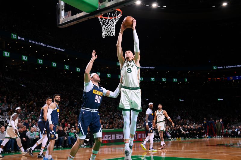 BOSTON, MA - JANUARY 19:   Kristaps Porzingis #8 of the Boston Celtics drives to the basket during the game against the Denver Nuggets on January 19, 2024 at the TD Garden in Boston, Massachusetts. NOTE TO USER: User expressly acknowledges and agrees that, by downloading and or using this photograph, User is consenting to the terms and conditions of the Getty Images License Agreement. Mandatory Copyright Notice: Copyright 2024 NBAE  (Photo by Brian Babineau/NBAE via Getty Images)