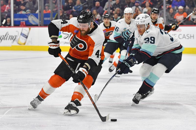 Feb 10, 2024; Philadelphia, Pennsylvania, USA; Philadelphia Flyers left wing Nicolas Deslauriers (44) is defended by Seattle Kraken defenseman Ryker Evans (39) during the first period at Wells Fargo Center. Mandatory Credit: Eric Hartline-USA TODAY Sports