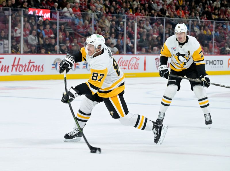 Oct 14, 2024; Montreal, Quebec, CAN; Pittsburgh Penguins forward Sidney Crosby (87) takes a shot during the first period of the game against the Montreal Canadiens at the Bell Centre. Mandatory Credit: Eric Bolte-Imagn Images