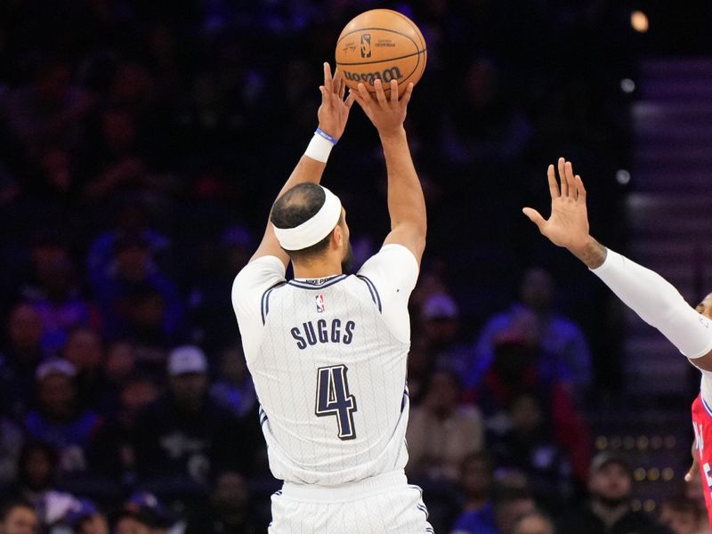 PHILADELPHIA, PA - DECEMBER 6: Jalen Suggs #4 of the Orlando Magic shoots the ball during the game against the Philadelphia 76ers on December 6, 2024 at the Wells Fargo Center in Philadelphia, Pennsylvania NOTE TO USER: User expressly acknowledges and agrees that, by downloading and/or using this Photograph, user is consenting to the terms and conditions of the Getty Images License Agreement. Mandatory Copyright Notice: Copyright 2024 NBAE (Photo by Jesse D. Garrabrant/NBAE via Getty Images)