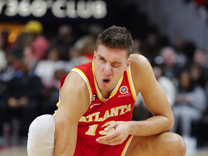 ATLANTA, GA - MARCH 03: Bogdan Bogdanovic #13 of the Atlanta Hawks reacts after a foul during the second half against the Portland Trail Blazers at State Farm Arena on March 3, 2023 in Atlanta, Georgia. NOTE TO USER: User expressly acknowledges and agrees that, by downloading and or using this photograph, User is consenting to the terms and conditions of the Getty Images License Agreement. (Photo by Todd Kirkland/Getty Images)