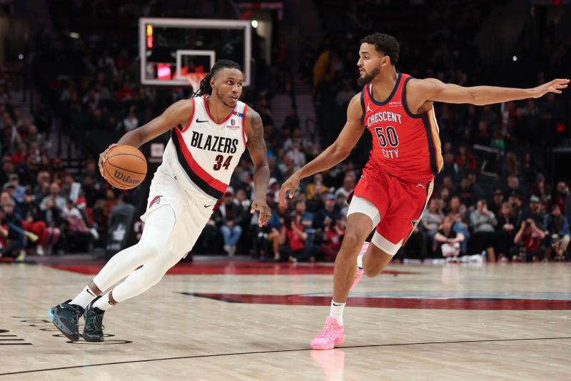 PORTLAND, OREGON - OCTOBER 27: Jabari Walker #34 of the Portland Trail Blazers brings the ball up court as Jeremiah Robinson-Earl #50 of the New Orleans Pelicans defends during the fourth quarter at Moda Center on October 27, 2024 in Portland, Oregon. NOTE TO USER: User expressly acknowledges and agrees that, by downloading and or using this photograph, User is consenting to the terms and conditions of the Getty Images License Agreement.? (Photo by Amanda Loman/Getty Images)