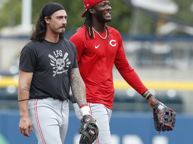 Jun 18, 2024; Pittsburgh, Pennsylvania, USA;  Cincinnati Reds second baseman Jonathan India (left) and shortstop Elly De La Cruz (right) during warm ups before a game against the Pittsburgh Pirates at PNC Park. Mandatory Credit: Charles LeClaire-USA TODAY Sports