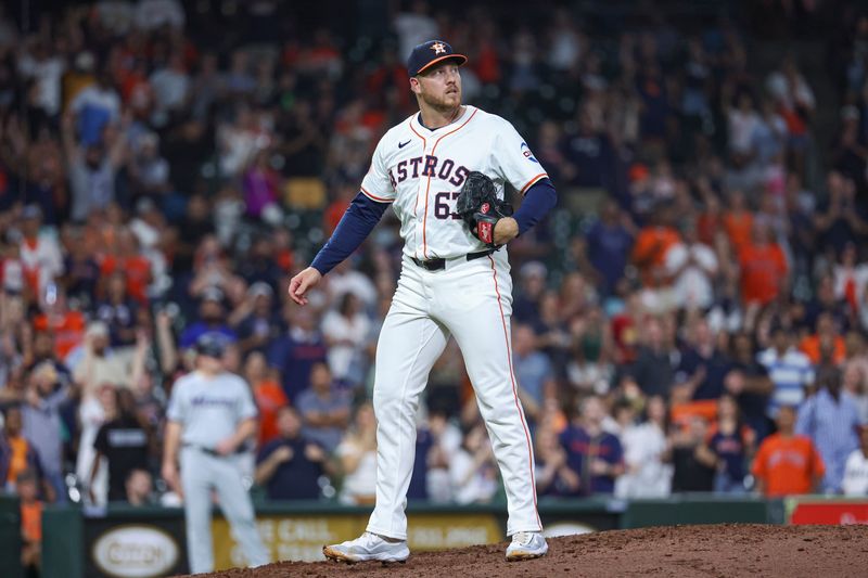 Jul 10, 2024; Houston, Texas, USA; Houston Astros relief pitcher Kaleb Ort (63) reacts after a play during the ninth inning against the Miami Marlins at Minute Maid Park. Mandatory Credit: Troy Taormina-USA TODAY Sports