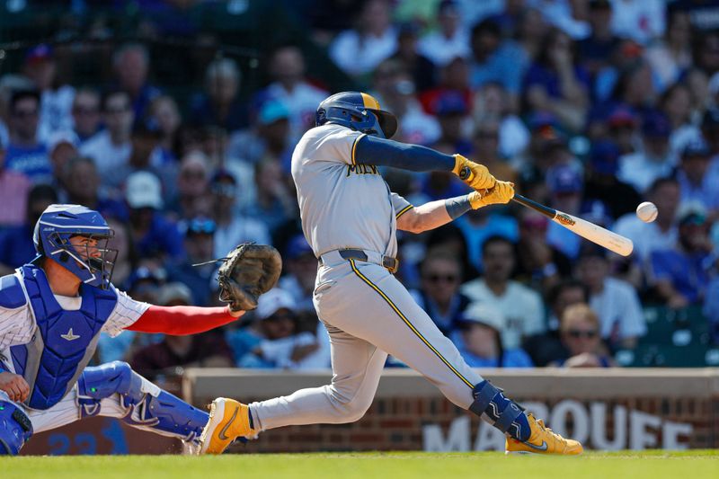 Aug 21, 2025; Chicago, Illinois, USA; Milwaukee Brewers left fielder Isaac Collins (6) hits a two-run single against the Chicago Cubs during the eight inning at Wrigley Field. Mandatory Credit: Kamil Krzaczynski-Imagn Images