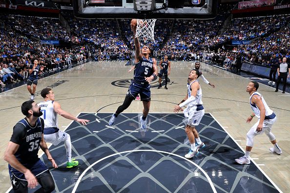 ORLANDO, FL - NOVEMBER 6: Paolo Banchero #5 of the Orlando Magic drives to the basket during the game against the Dallas Mavericks on November 6, 2023 at Amway Center in Orlando, Florida. NOTE TO USER: User expressly acknowledges and agrees that, by downloading and or using this photograph, User is consenting to the terms and conditions of the Getty Images License Agreement. Mandatory Copyright Notice: Copyright 2023 NBAE (Photo by Fernando Medina/NBAE via Getty Images)