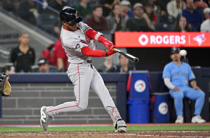 Sep 24, 2024; Toronto, Ontario, CAN; Boston Red Sox center fielder Ceddanne Rafaela (43) hits a two run RBI single against the Toronto Blue Jays in the seventh inning at Rogers Centre. Mandatory Credit: Dan Hamilton-Imagn Images