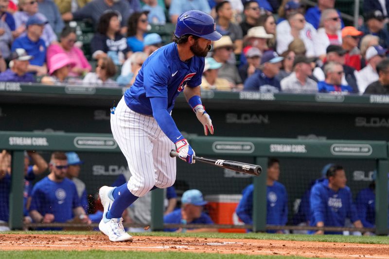 Mar 6, 2024; Mesa, Arizona, USA; Chicago Cubs shortstop Dansby Swanson (7) hits a single against the Los Angeles Angels in the second inning at Sloan Park. Mandatory Credit: Rick Scuteri-USA TODAY Sports