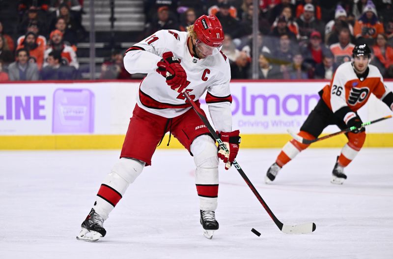 Nov 28, 2023; Philadelphia, Pennsylvania, USA; Carolina Hurricanes center Jordan Staal (11) gains control of the puck against the Philadelphia Flyers in the first period at Wells Fargo Center. Mandatory Credit: Kyle Ross-USA TODAY Sports