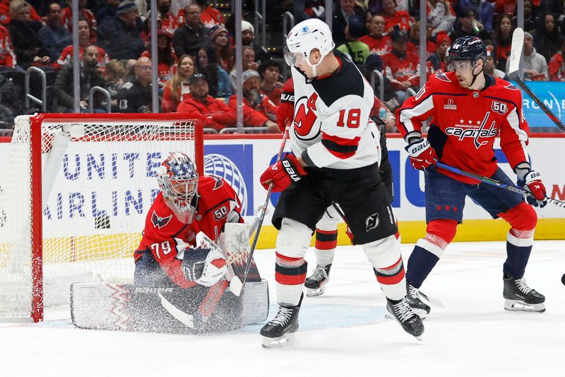 Nov 23, 2024; Washington, District of Columbia, USA; Washington Capitals goaltender Charlie Lindgren (79) makes a save in front of New Jersey Devils left wing Ondrej Palat (18) in the second period at Capital One Arena. Mandatory Credit: Geoff Burke-Imagn Images