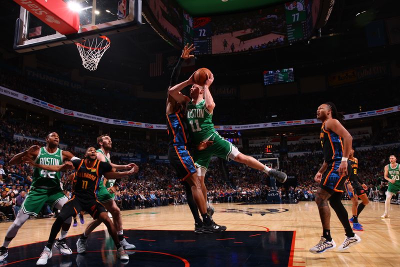 OKLAHOMA CITY, OK - JANUARY 5: Payton Pritchard #11 of the Boston Celtics drives to the basket during the game against the Oklahoma City Thunder on January 5, 2025 at Paycom Center in Oklahoma City, Oklahoma. NOTE TO USER: User expressly acknowledges and agrees that, by downloading and or using this photograph, User is consenting to the terms and conditions of the Getty Images License Agreement. Mandatory Copyright Notice: Copyright 2025 NBAE (Photo by Zach Beeker/NBAE via Getty Images)