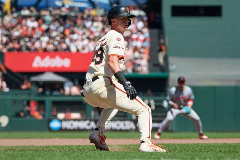 Aug 10, 2024; San Francisco, California, USA; San Francisco Giants outfielder Tyler Fitzgerald (49) takes a lead from third base against the Detroit Tigers during the seventh inning at Oracle Park. Mandatory Credit: Robert Edwards-USA TODAY Sports