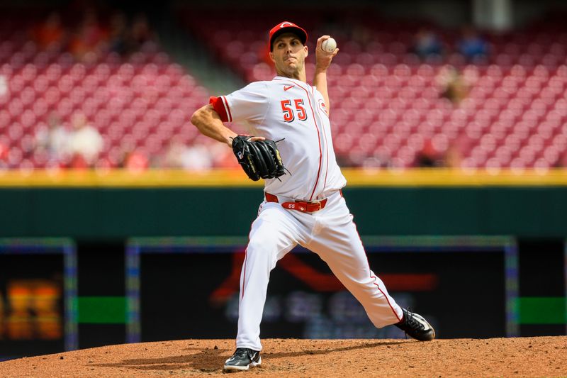 Apr 30, 2025; Cincinnati, Ohio, USA; Cincinnati Reds relief pitcher Taylor Rogers (55) pitches against the St. Louis Cardinals in the seventh inning at Great American Ball Park. Mandatory Credit: Katie Stratman-Imagn Images