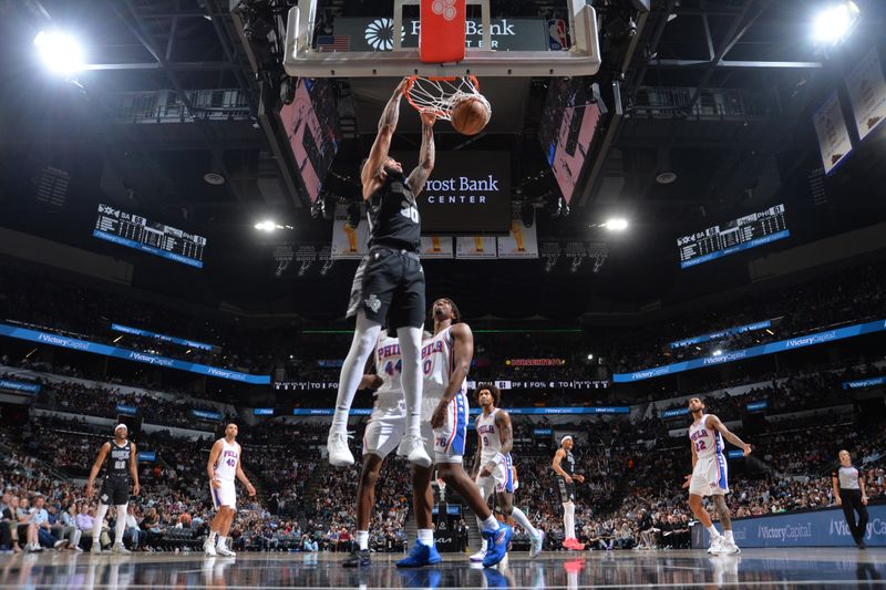 SAN ANTONIO, TX - APRIL 7: Julian Champagnie #30 of the San Antonio Spurs dunks the ball during the game against the Philadelphia 76ers on April 7, 2024 at the Frost Bank Center in San Antonio, Texas. NOTE TO USER: User expressly acknowledges and agrees that, by downloading and or using this photograph, user is consenting to the terms and conditions of the Getty Images License Agreement. Mandatory Copyright Notice: Copyright 2024 NBAE (Photos by Michael Gonzales/NBAE via Getty Images)