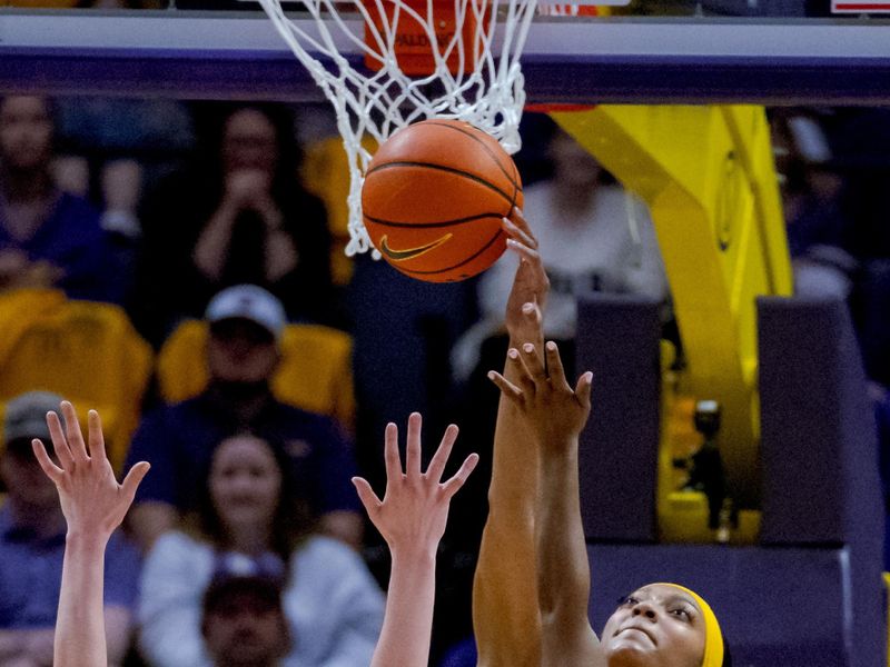 Mar 3, 2024; Baton Rouge, Louisiana, USA; LSU Lady Tigers forward Angel Reese (10) blocks the shot of Kentucky Wildcats guard Saniah Tyler (2) during the first half at Pete Maravich Assembly Center. Mandatory Credit: Matthew Hinton-USA TODAY Sports