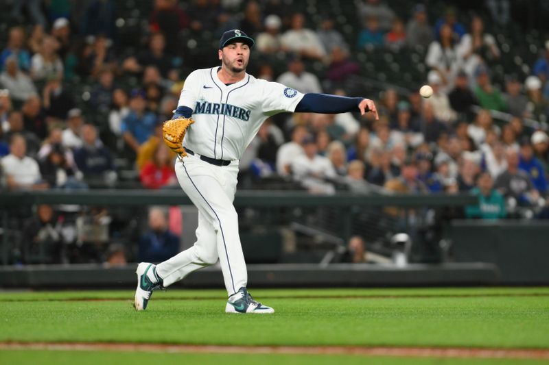 Sep 12, 2024; Seattle, Washington, USA; Seattle Mariners relief pitcher Tayler Saucedo (60) throws to first base for a force out against the Texas Rangers during the eighth inning at T-Mobile Park. Mandatory Credit: Steven Bisig-Imagn Images