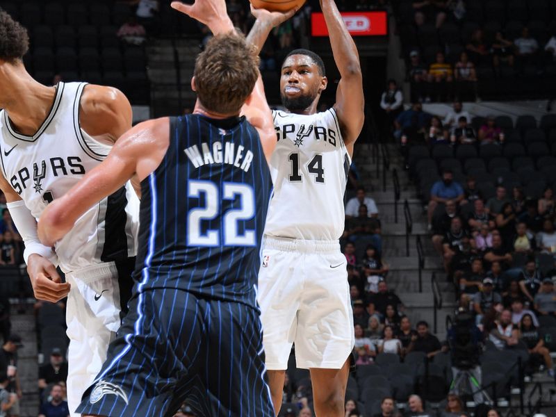 SAN ANTONIO, TX - OCTOBER 9: Blake Wesley #14 of the San Antonio Spurs shoots a three point basket during the game against the Orlando Magic during a NBA preseason game on October 9, 2024 at the Frost Bank Center in San Antonio, Texas. NOTE TO USER: User expressly acknowledges and agrees that, by downloading and or using this photograph, user is consenting to the terms and conditions of the Getty Images License Agreement. Mandatory Copyright Notice: Copyright 2024 NBAE (Photos by Michael Gonzales/NBAE via Getty Images)
