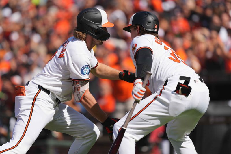 Sep 2, 2024; Baltimore, Maryland, USA; Baltimore Orioles shortstop Gunnar Henderson (left) is greeted after his first inning solo home run by catcher Adley Rutschman (right) against the Chicago White Sox at Oriole Park at Camden Yards. Mandatory Credit: Mitch Stringer-USA TODAY Sports