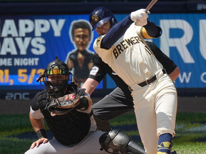 May 15, 2024; Milwaukee, Wisconsin, USA; Milwaukee Brewers outfielder Jackson Chourio (11) hits a two-run home run off of Pittsburgh Pirates pitcher Martín Pérez during the sixth inning at American Family Field . Mandatory Credit: Mark Hoffman-USA TODAY Sports