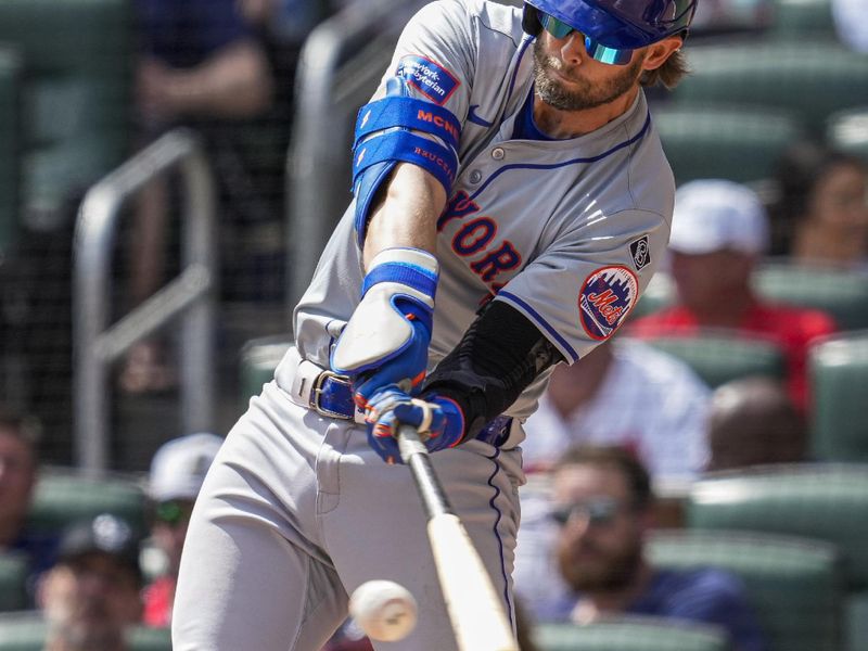 Apr 11, 2024; Cumberland, Georgia, USA; New York Mets second baseman Jeff McNeil (1) singles to drive in two runs against the Atlanta Braves during the seventh inning at Truist Park. Mandatory Credit: Dale Zanine-USA TODAY Sports