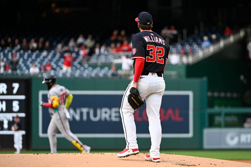 May 22, 2025; Washington, District of Columbia, USA; Washington Nationals pitcher Trevor Williams (32) reacts after giving up a solo home run to Atlanta Braves designated hitter Marcell Ozuna (20) during the first inning at Nationals Park. Mandatory Credit: Brad Mills-Imagn Images