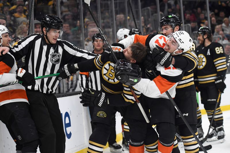 Mar 16, 2024; Boston, Massachusetts, USA; Philadelphia Flyers left wing Noah Cates (27) grabs a hold of Boston Bruins left wing James van Riemsdyk (21) during the second period at TD Garden. Mandatory Credit: Bob DeChiara-USA TODAY Sports