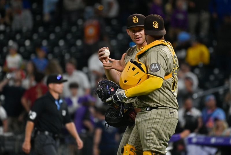 May 10, 2025; Denver, Colorado, USA;  San Diego Padres catcher Elias Díaz (17) gives the ball to San Diego Padres pitcher Stephen Kolek (32) after his complete game shutout of the Colorado Rockies at Coors Field. Mandatory Credit: John Leyba-Imagn Images