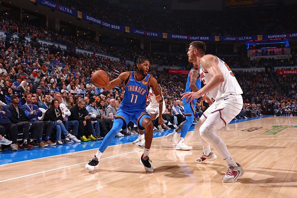 OKLAHOMA CITY, OK - DECEMBER 27: Isaiah Joe #11 of the Oklahoma City Thunder dribbles the ball during the game against the New York Knicks on December 27, 2023 at Paycom Arena in Oklahoma City, Oklahoma. NOTE TO USER: User expressly acknowledges and agrees that, by downloading and or using this photograph, User is consenting to the terms and conditions of the Getty Images License Agreement. Mandatory Copyright Notice: Copyright 2023 NBAE (Photo by Zach Beeker/NBAE via Getty Images)