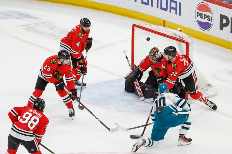 Mar 17, 2024; Chicago, Illinois, USA; San Jose Sharks center Klim Kostin (10) scores a goal against the Chicago Blackhawks during the first period at United Center. Mandatory Credit: Kamil Krzaczynski-USA TODAY Sports