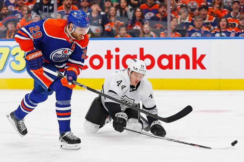 Apr 22, 2024; Edmonton, Alberta, CAN; Los Angeles Kings defensemen Mikey Anderson (44) knocks the puck away from Edmonton Oilers forward Leon Draisaitl (29) during the first period in game one of the first round of the 2024 Stanley Cup Playoffs at Rogers Place. Mandatory Credit: Perry Nelson-USA TODAY Sports