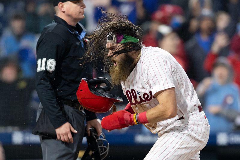 Apr 26, 2023; Philadelphia, Pennsylvania, USA; Philadelphia Phillies center fielder Brandon Marsh (16) reacts after scoring the go ahead run during the eighth inning against the Seattle Mariners at Citizens Bank Park. Mandatory Credit: Bill Streicher-USA TODAY Sports