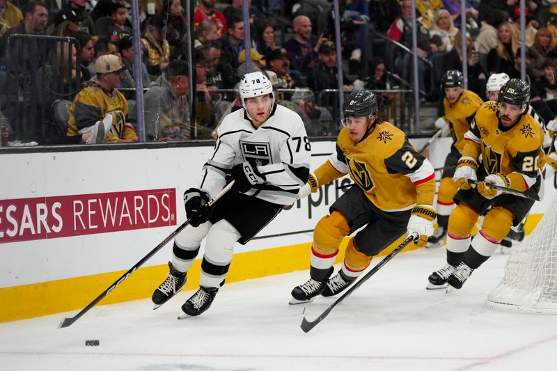 Dec 28, 2023; Las Vegas, Nevada, USA; Los Angeles Kings right wing Alex Laferriere (78) skates with the puck against Vegas Golden Knights defenseman Zach Whitecloud (2) during the third period at T-Mobile Arena. Mandatory Credit: Lucas Peltier-USA TODAY Sports