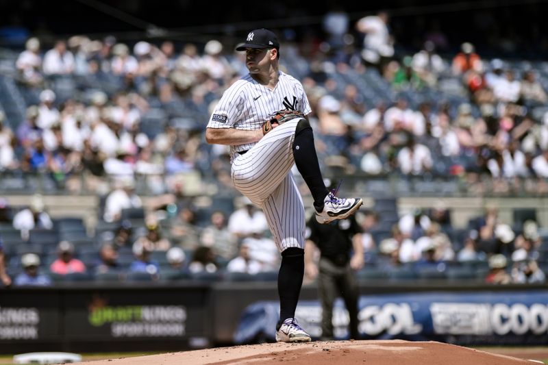 Aug 10, 2024; Bronx, New York, USA; New York Yankees pitcher Carlos Rodón (55) pitches against the Texas Rangers during the first inning at Yankee Stadium. Mandatory Credit: John Jones-USA TODAY Sports