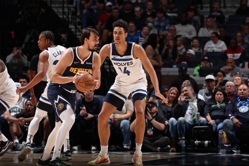 MINNEAPOLIS, MN -  OCTOBER 17: Jesse Edwards #14 of the Minnesota Timberwolves plays defense during the game against the Denver Nuggets during the 2024 NBA Preseason on October 17, 2024 at Target Center in Minneapolis, Minnesota. NOTE TO USER: User expressly acknowledges and agrees that, by downloading and or using this Photograph, user is consenting to the terms and conditions of the Getty Images License Agreement. Mandatory Copyright Notice: Copyright 2024 NBAE (Photo by David Sherman/NBAE via Getty Images)