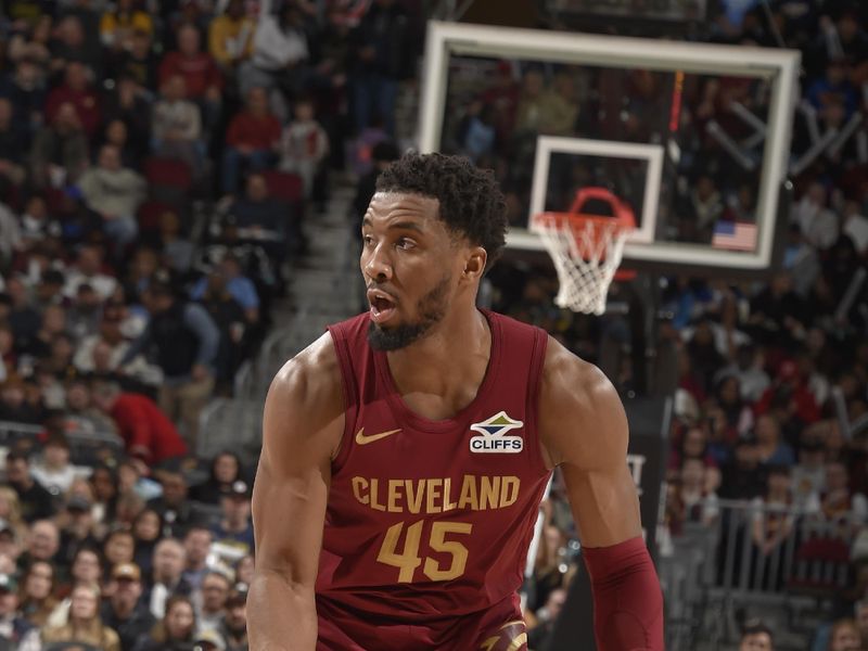 CLEVELAND, OH - FEBRUARY 23: Donovan Mitchell #45 of the Cleveland Cavaliers dribbles the ball during the game against the Memphis Grizzlies on February 23 , 2025 at Rocket Arena in Cleveland, Ohio. NOTE TO USER: User expressly acknowledges and agrees that, by downloading and/or using this Photograph, user is consenting to the terms and conditions of the Getty Images License Agreement. Mandatory Copyright Notice: Copyright 2025 NBAE (Photo by David Liam Kyle/NBAE via Getty Images)