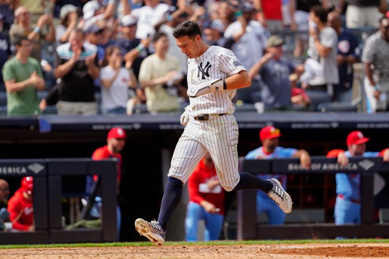 Aug 31, 2024; Bronx, New York, USA; New York Yankees shortstop Anthony Volpe (11) scores a run on New York Yankees designated hitter Giancarlo Stanton (not pictured) RBI double against the St. Louis Cardinals during the eighth inning at Yankee Stadium. Mandatory Credit: Gregory Fisher-USA TODAY Sports
