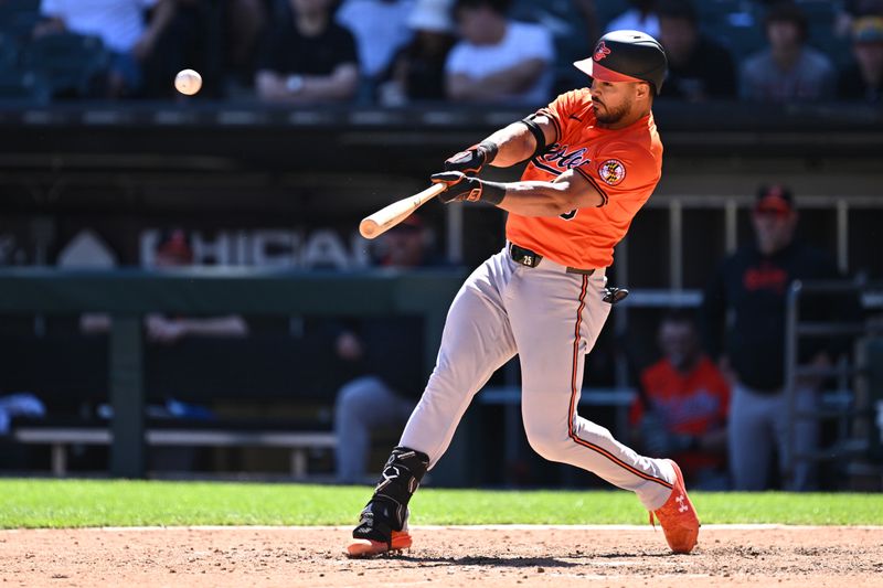 May 25, 2024; Chicago, Illinois, USA;  Baltimore Orioles outfielder Anthony Santander (25) hits a two-run home run in the eighth inning against the Chicago White Sox at Guaranteed Rate Field. Mandatory Credit: Jamie Sabau-USA TODAY Sports