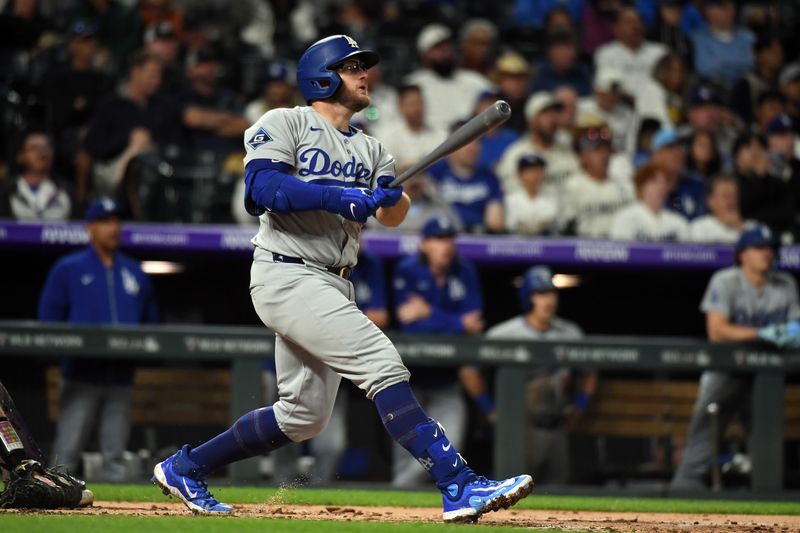 Jun 25, 2025; Denver, Colorado, USA; Los Angeles Dodgers third base Max Muncy (13) hits a grand slam during the seventh inning against the Colorado Rockies at Coors Field. Mandatory Credit: Christopher Hanewinckel-Imagn Images