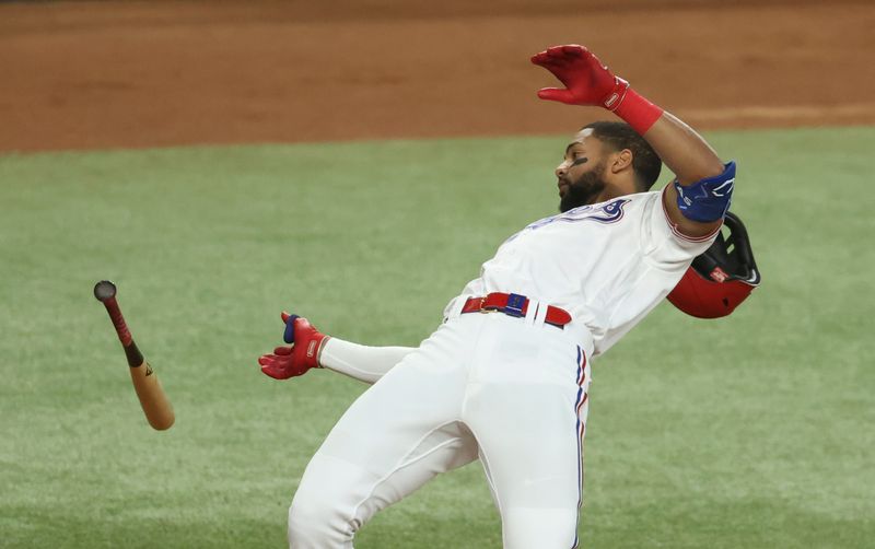 Jun 28, 2023; Arlington, Texas, USA;  Texas Rangers center fielder Leody Taveras (3) gets brushed off the plate during the first inning against the Detroit Tigers at Globe Life Field. Mandatory Credit: Kevin Jairaj-USA TODAY Sports