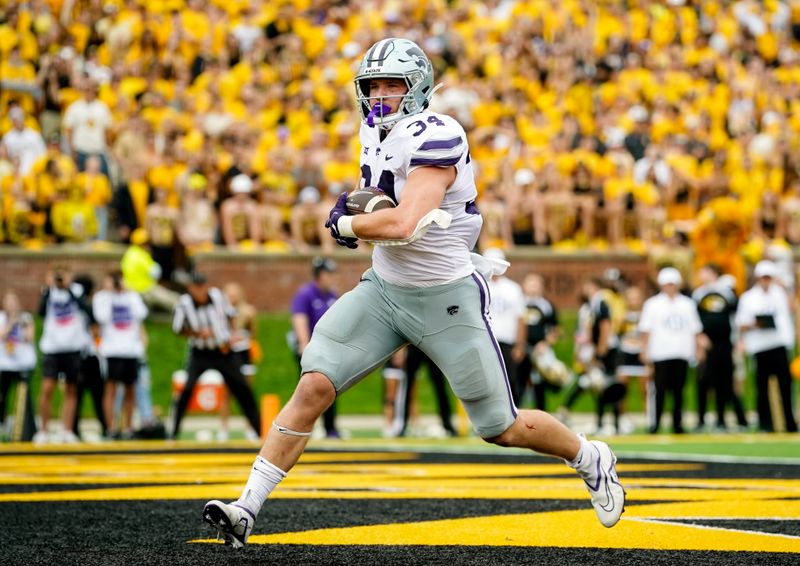 Sep 16, 2023; Columbia, Missouri, USA; Kansas State Wildcats tight end Ben Sinnott (34) scores a touchdown during the second half against the Missouri Tigers at Faurot Field at Memorial Stadium. Mandatory Credit: Jay Biggerstaff-USA TODAY Sports