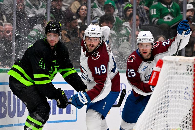 Nov 29, 2024; Dallas, Texas, USA; Dallas Stars defenseman Miro Heiskanen (4) and Colorado Avalanche defenseman Samuel Girard (49) and right wing Logan O'Connor (25) chase the puck behind the Dallas net during the third period at the American Airlines Center. Mandatory Credit: Jerome Miron-Imagn Images