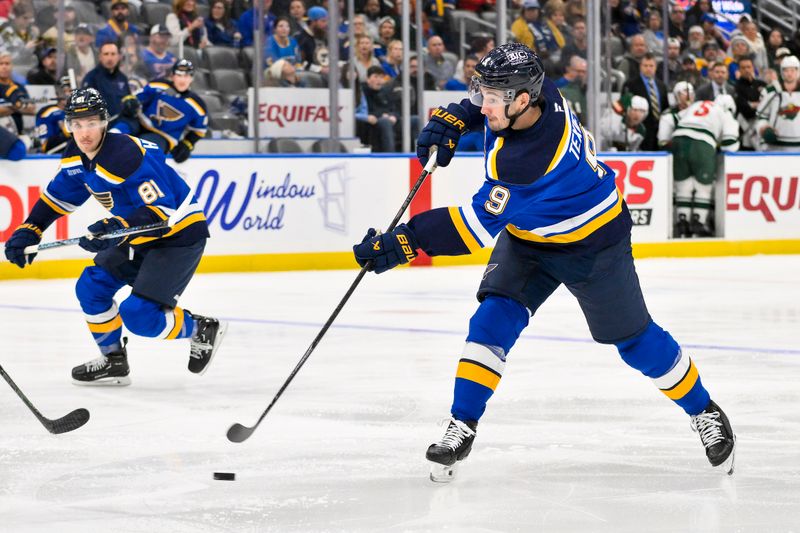 Nov 19, 2024; St. Louis, Missouri, USA;  St. Louis Blues center Alexandre Texier (9) shoots against the Minnesota Wild during the second period at Enterprise Center. Mandatory Credit: Jeff Curry-Imagn Images