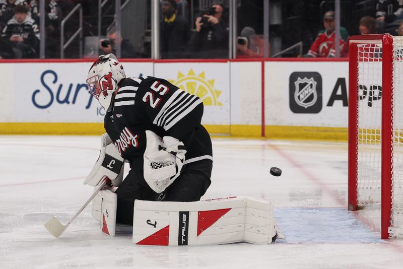 Mar 12, 2026; Newark, New Jersey, USA; Calgary Flames center John Beecher (18) (not shown) scores a goal on New Jersey Devils goaltender Jacob Markstrom (25) during the first period at Prudential Center. Mandatory Credit: Ed Mulholland-Imagn Images