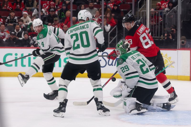 Dec 3, 2025; Newark, New Jersey, USA; Dallas Stars goaltender Jake Oettinger (29) makes a save against the New Jersey Devils during the second period at Prudential Center. Mandatory Credit: Ed Mulholland-Imagn Images