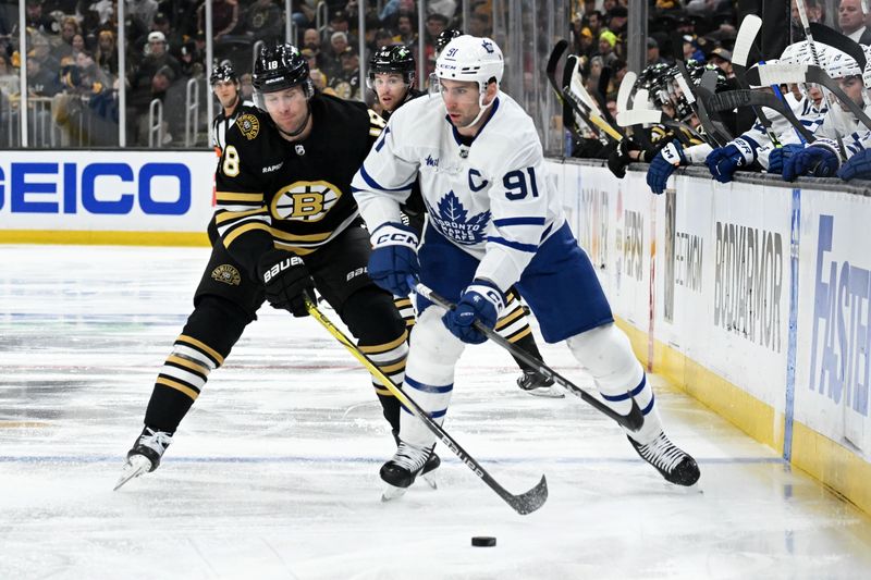 Apr 22, 2024; Boston, Massachusetts, USA; Boston Bruins center Pavel Zacha (18) defends Toronto Maple Leafs center John Tavares (91) during the first period in game two of the first round of the 2024 Stanley Cup Playoffs at TD Garden. Mandatory Credit: Brian Fluharty-USA TODAY Sports