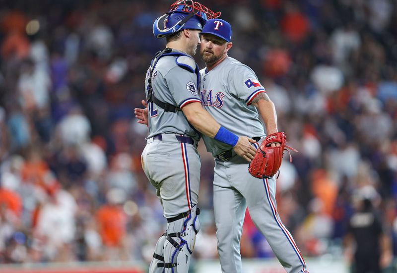 Jul 14, 2024; Houston, Texas, USA; Texas Rangers relief pitcher Kirby Yates (39) celebrates with catcher Andrew Knizner (12) after the game against the Houston Astros at Minute Maid Park. Mandatory Credit: Troy Taormina-USA TODAY Sports