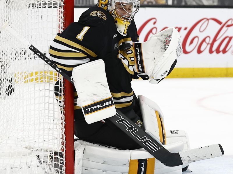 May 10, 2024; Boston, Massachusetts, USA; Boston Bruins goaltender Jeremy Swayman (1) makes a chest save against the Florida Panthers during the second period of game three of the second round of the 2024 Stanley Cup Playoffs at TD Garden. Mandatory Credit: Winslow Townson-USA TODAY Sports